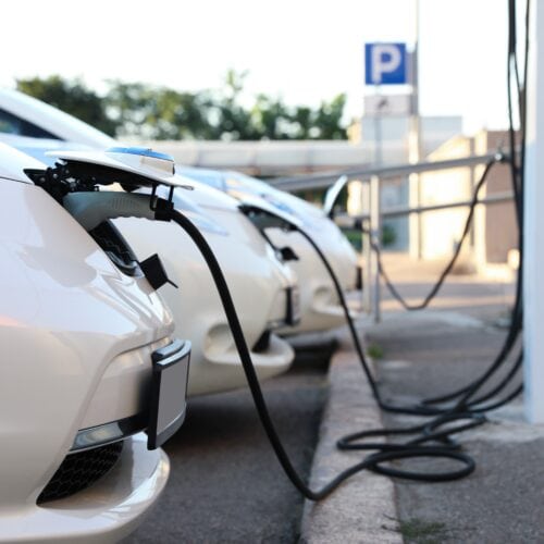 Charging modern electric cars from station outdoors